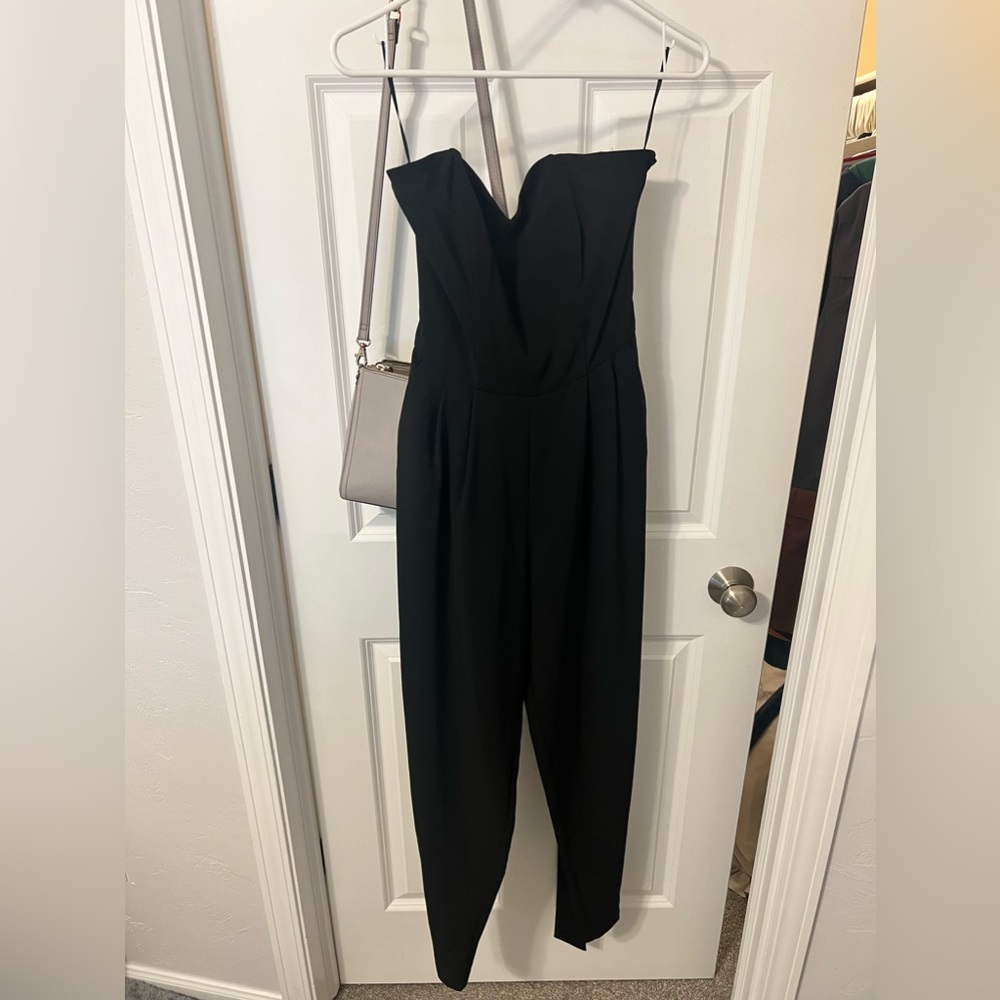 Black strapless jumpsuit with waist tie